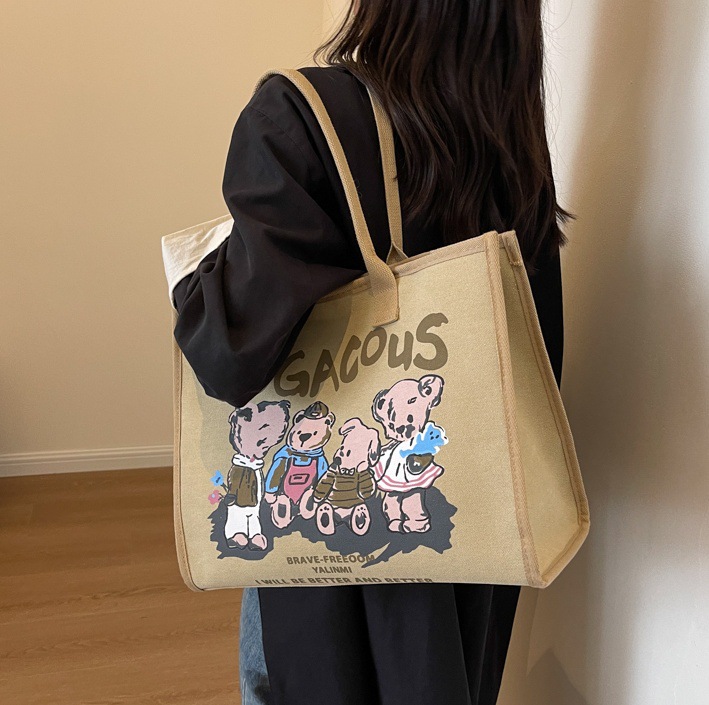 Autumn and winter retro large-capacity canvas bag for women, 2024 new trendy and fashionable cartoon handbag, commuter single-shoulder tote bag full figure