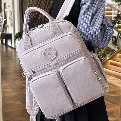 Solid-color Japanese-style women's casual backpack, lightweight nylon multi-pocket waterproof travel backpack, computer bag, multi-functional bag Application Scenario