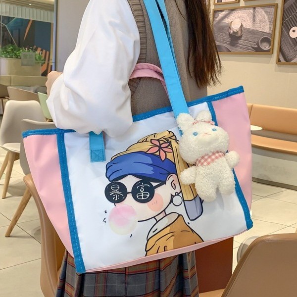A versatile cartoon new cute large-capacity class handbag, student shoulder bag, printed graffiti, fresh tote bag details Picture