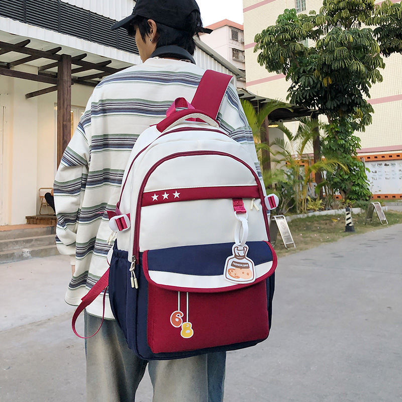 The new college student backpack features a contrasting color, is lightweight and has a large capacity. It is a retro workwear backpack details Picture