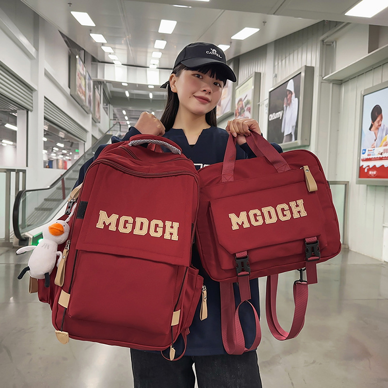 New Korean version large-capacity backpacks with letters for both men and women are available in spring. This two-piece set is a versatile backpack for junior and senior high school students full figure