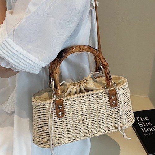 Drawstring casual hand-woven straw bag 2025 new summer, high-end and niche design, crossbody and hand-held shell bag full figure