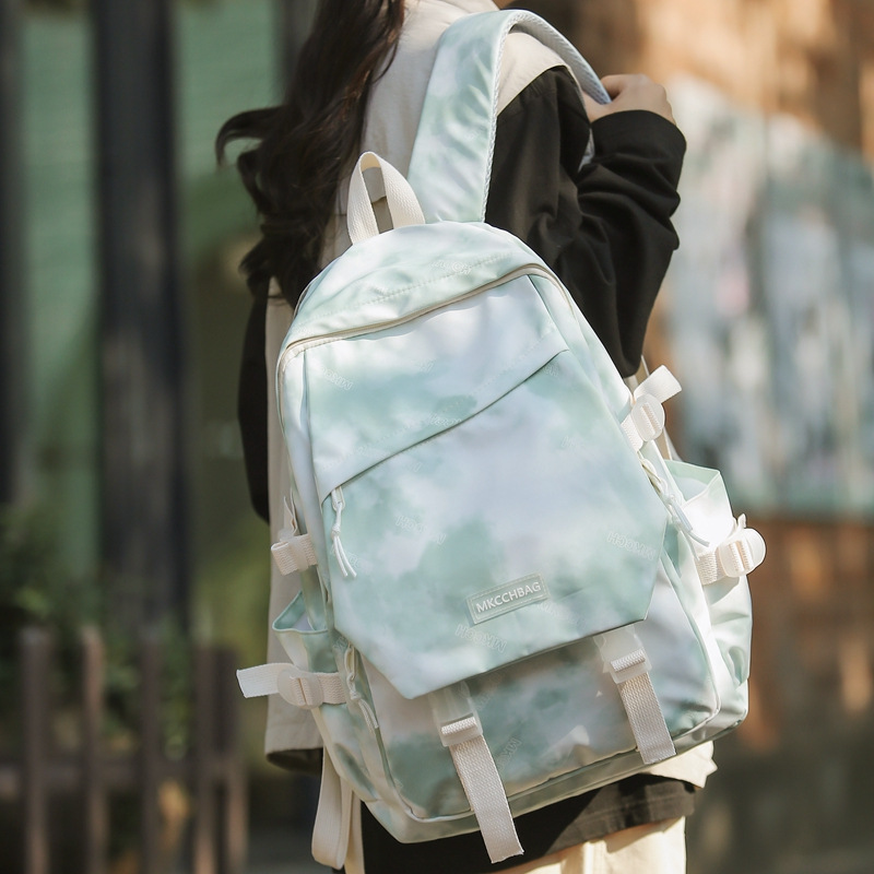 This backpack features a large capacity, high-end feel, and a niche tie-dye design. It is a schoolbag for girls and is lightweight for junior high school students full figure