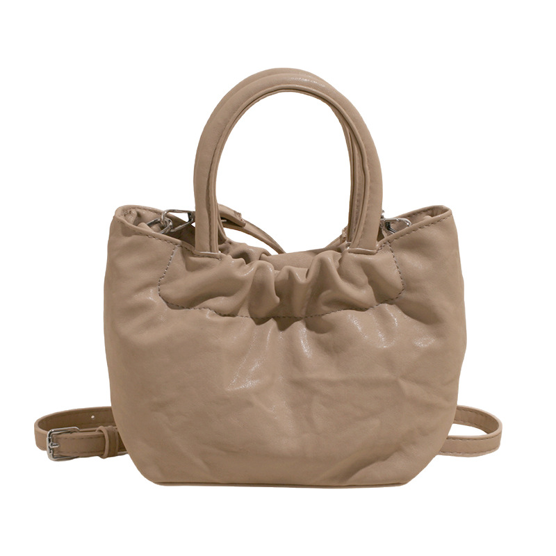 The 2025 new niche design solid-color hand-held bucket bag exudes a sense of sophistication, simplicity and fashion, and is a single-shoulder crossbody bag for commuting Item Picture