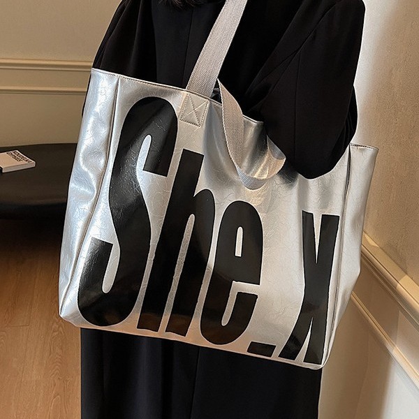 A new large-capacity hand-held women's fashionable Korean-style commuting bag for autumn and winter, a high-end textured tote bag with large letters and European and American style details Picture