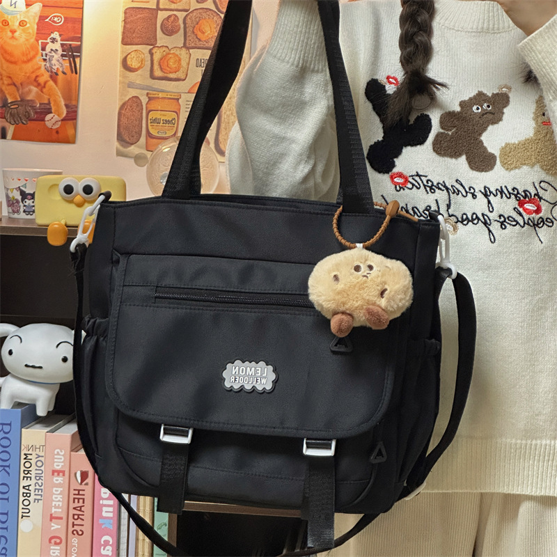 Solid-color commuting single-shoulder crossbody bag, large-capacity forest-style girl hand-held tote bag, cute student class tutorial bag details Picture
