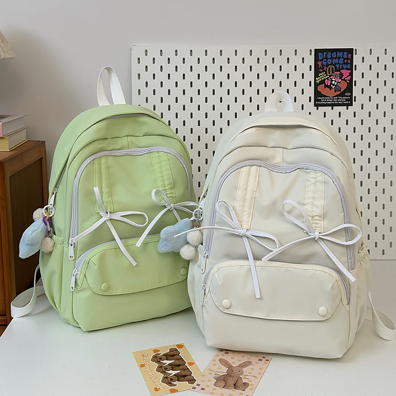 New pleated drawstring bow design schoolbag for female junior high school, senior high school and college students traveling on backpacks full figure