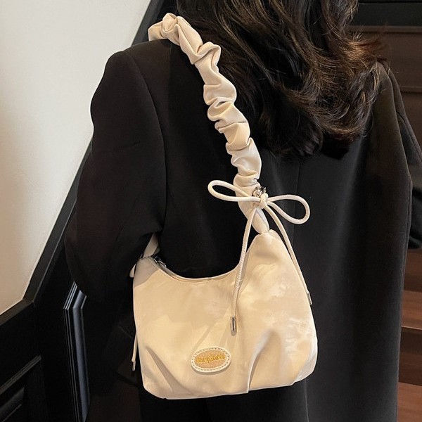 Korean hand-held bucket bag 2025 new spring versatile, high-end and fashionable single-shoulder bag, niche design crossbody bag full figure