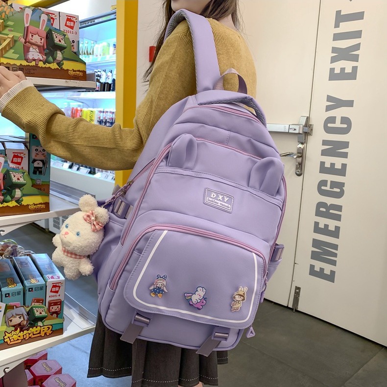 New simple and trendy middle school schoolbag, solid-color outdoor casual backpack, Korean-style nylon cartoon backpack for girls full figure