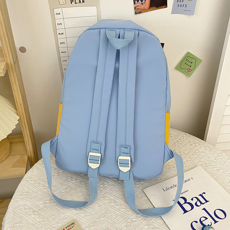 New nylon color-blocked large-capacity backpack for middle school students, an ins Korean version backpack for junior high school students' campus Application Scenario