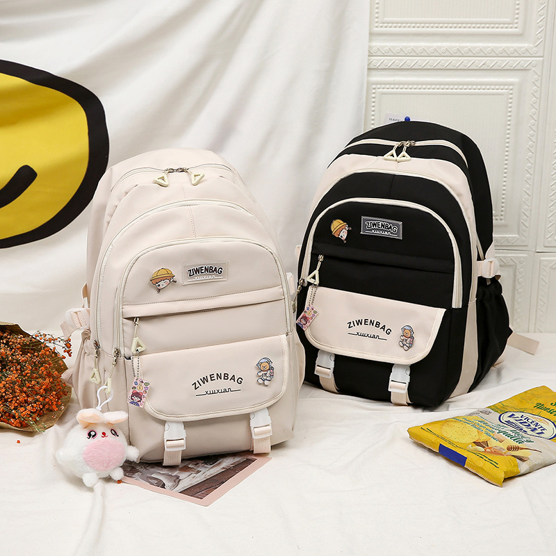 New color-blocking schoolbag for fourth-grade girls, backpacks for primary school students from grades one to six, and backpacks for girls and girls to protect their backs and shoulders full figure