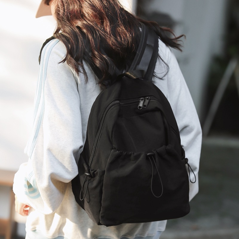 A new pink large-capacity, high-end casual commuting bag with a simple nylon travel backpack in the style of a cross-border college Specification drawing