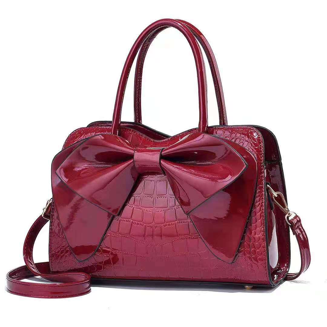 Cross-border foreign trade hand-held large bag 2022 New style fashionable crocodile pattern bow bucket bag patent leather shiny crossbody bag details Picture