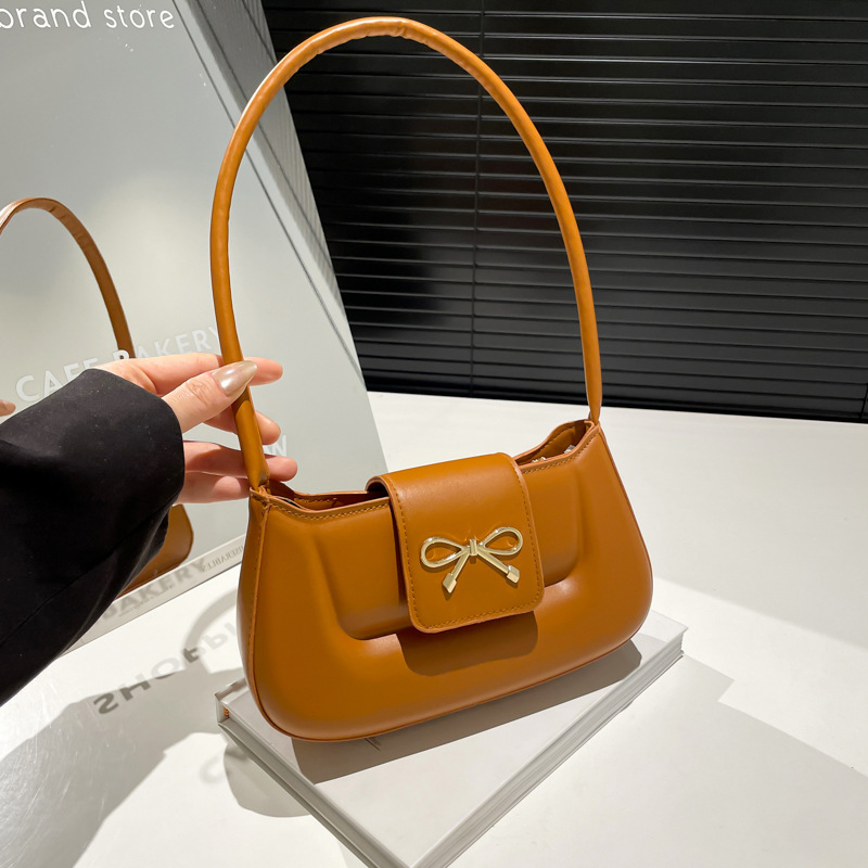 Embossed simple, casual and retro solid color 2025 Spring new style bow fashion design single-shoulder armpit small square bag full figure