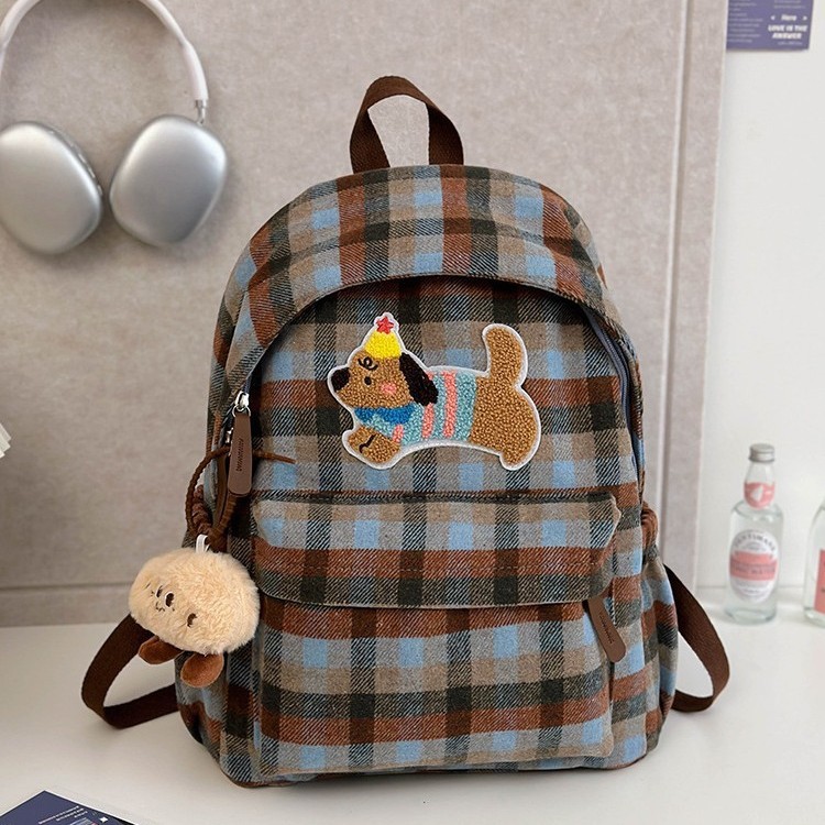 This is a new large-capacity backpack with a checkered pattern for autumn and winter. It features a cute puppy and a versatile student bag Specification drawing