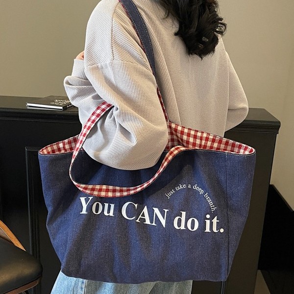This canvas bag features a niche design with an ins high-end feel. It's a large-capacity commuter single-shoulder bag with Korean-style striped shopping bags on both sides Specification drawing