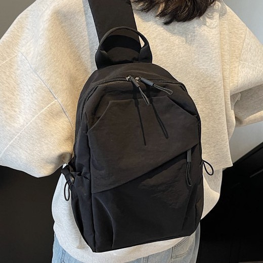 Solid-color backpack crossbody bag for men and women, light, simple, casual and fashionable new couple single-shoulder chest bag, trendy details Picture