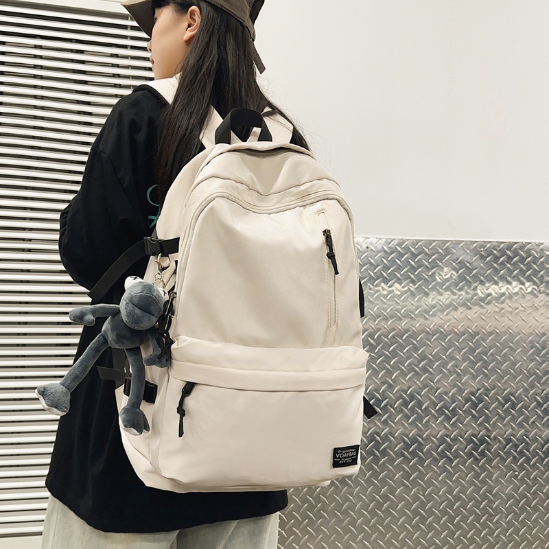 Outdoor backpack for teenagers to reduce burden and protect the spine, large-capacity lightweight school bag, simple and casual backpack for junior high school students details Picture