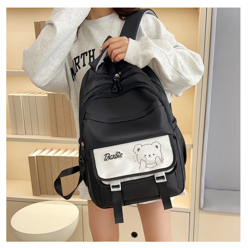 The 2025 new style of simple and cute large-capacity backpack is a lightweight and weight-reducing schoolbag for grades three, four and five, as well as for junior and senior high school students full figure