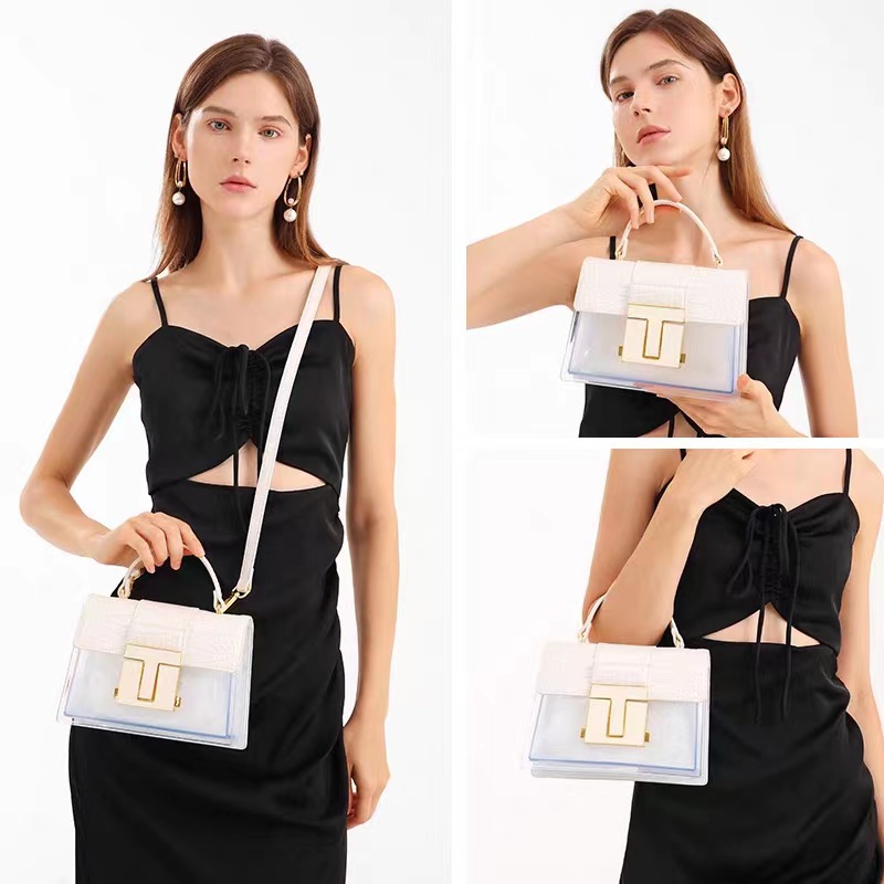 The 2025 new high-end and light luxury crocodile pattern saddle bag is a niche single-shoulder hand-held crossbody bag with a patchwork transparent color for women full figure