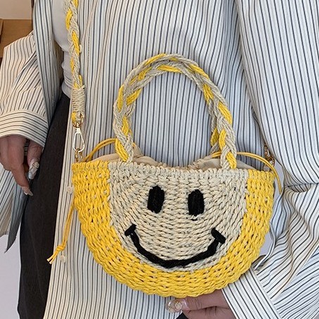 Cute smiling face hand-held straw woven bag, new and fresh bucket straw woven bag, vacation beach bag, versatile women's bag details Picture