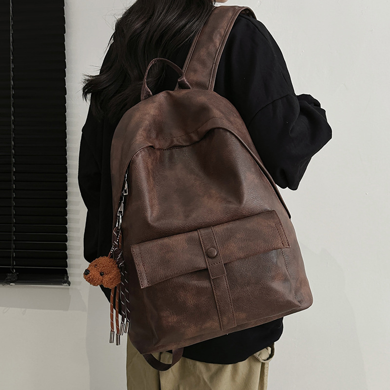 Hong Kong-style retro backpack for autumn and winter, new simple PU large-capacity student schoolbag, versatile travel and leisure backpack details Picture