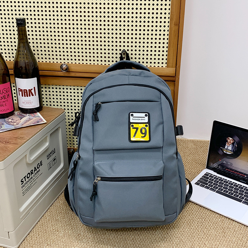 New solid-color casual backpack, lightweight schoolbag for junior high school, senior high school and college students, durable, load-reducing and spine-protecting study bag Specification drawing
