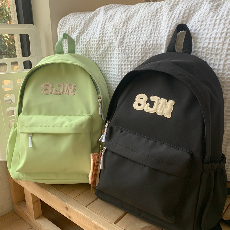 Simple and high-appearation-level schoolbag, solid-color, niche and simple campus-style backpack for junior high school and college students, travel and commuting backpack full figure