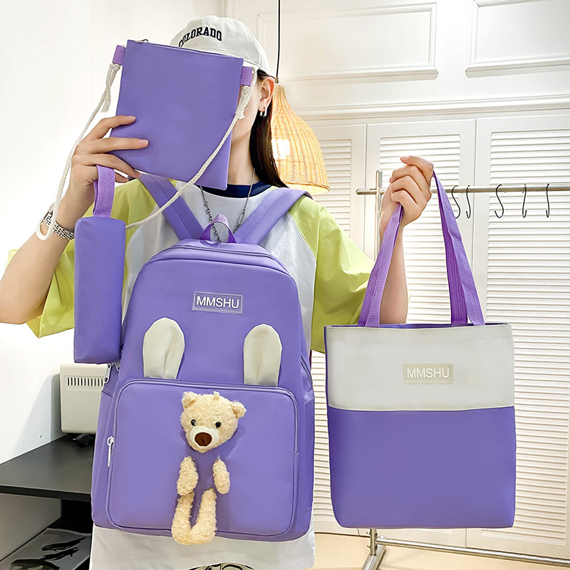 A cute cartoon bear backpack set of four pieces, a large-capacity hand-held after-school bag for primary school students, a casual and versatile trendy backpack full figure