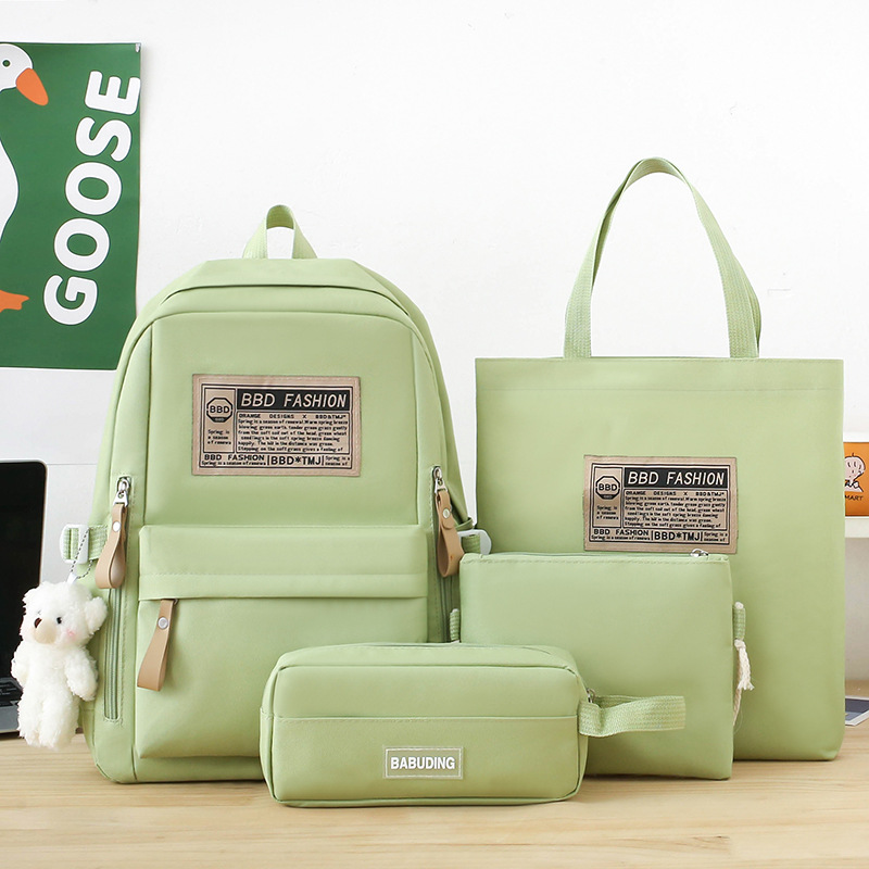 New simple Korean style casual backpack for girls, four-piece set, large capacity, versatile, lightweight backpack for primary and junior high school full figure