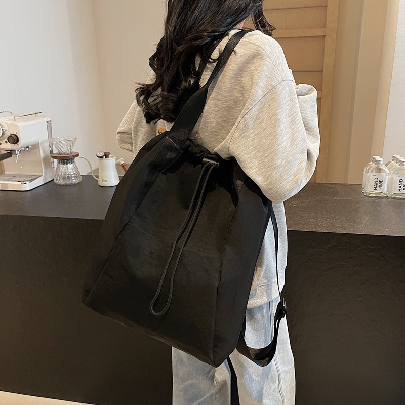 A new large-capacity, versatile Japanese solid-color, simple commuter backpack for women, multi-purpose drawstring handbag details Picture