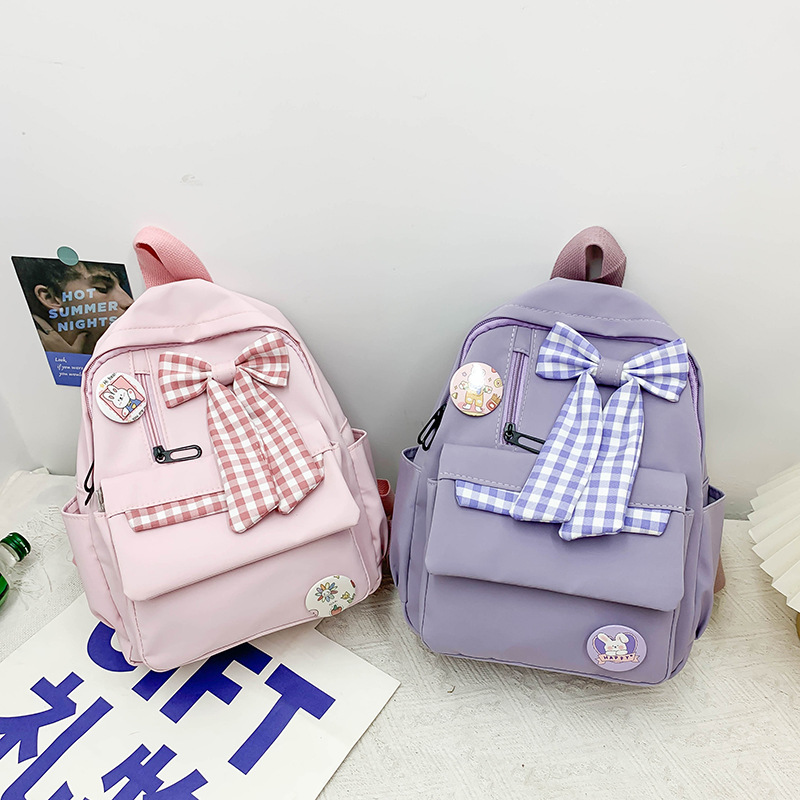 Bowknot schoolbag for female primary school students, large-capacity, lightweight, lightweight, cute and simple backpack for junior high school students from grades three to six full figure