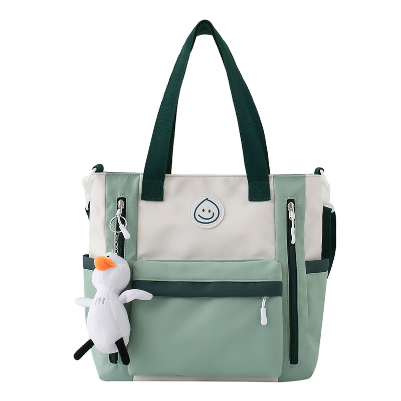 Color-blocking casual large-capacity tutorial bag, book bag for junior and senior high school students, hand-carried bag for class, high appearance level crossbody bag for girls Item Picture