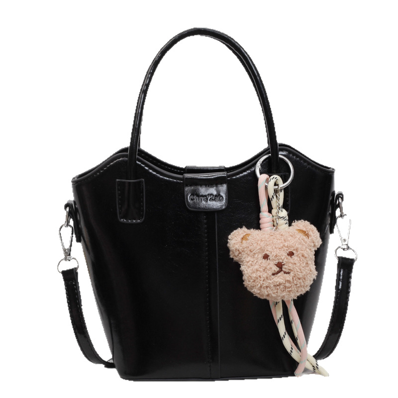 High-end and elegant solid-color hand-held bucket bag for women, 2025 new style, fashionable and simple, casual commuting single-shoulder crossbody bag Item Picture