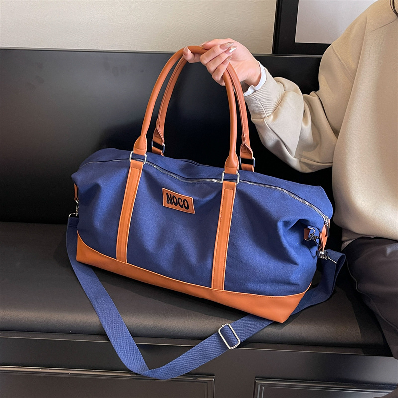 Wholesale of Korean-style hand-held travel bags, short-distance large-capacity luggage bags for men and women, fashionable and casual canvas yoga and fitness bags full figure