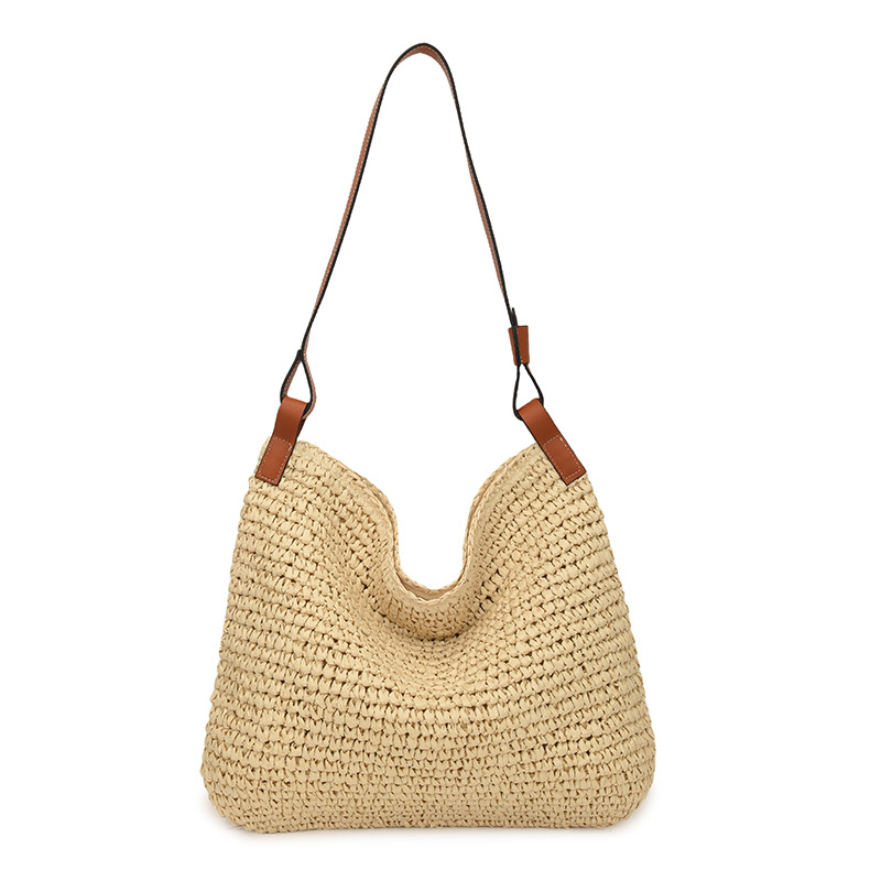 This is a versatile, simple, woven and hollowed-out women's 2025 spring new hand-held bucket bag and casual shoulder bag Item Picture