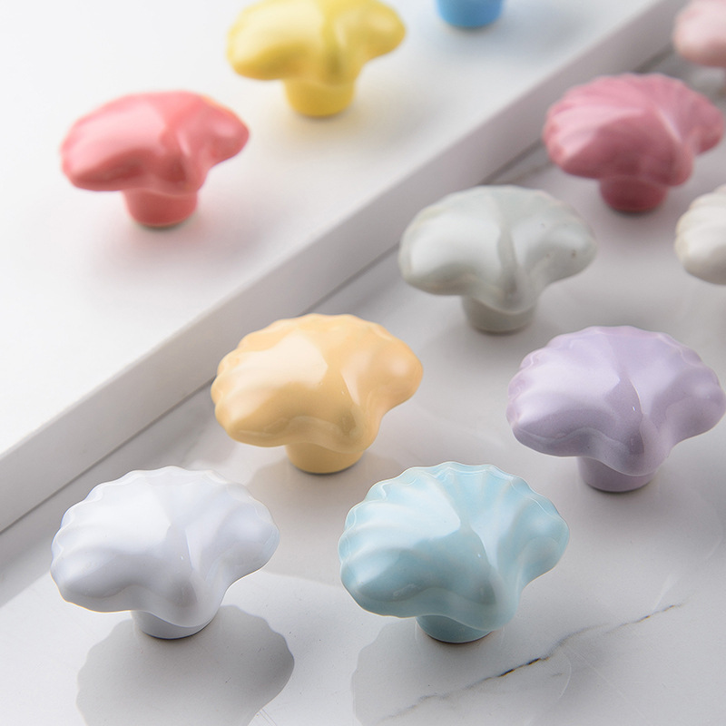 The manufacturer sells ceramic handles, Marine creative, simple and modern colored ceramic shell handles, cabinet doors, drawers and kitchen cabinets details Picture