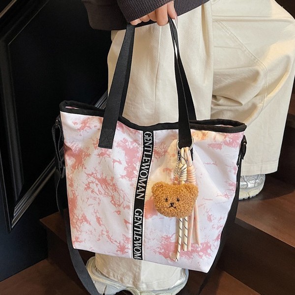 Large-capacity women's 2025 autumn new graffiti tie-dyed canvas handbag, fashionable and casual single-shoulder tote bag full figure