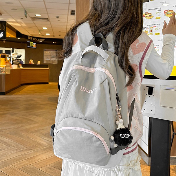 Korean sweet and cool schoolbag for female college students, a niche design with high appearance standards, a lightweight travel backpack for girls in high school full figure