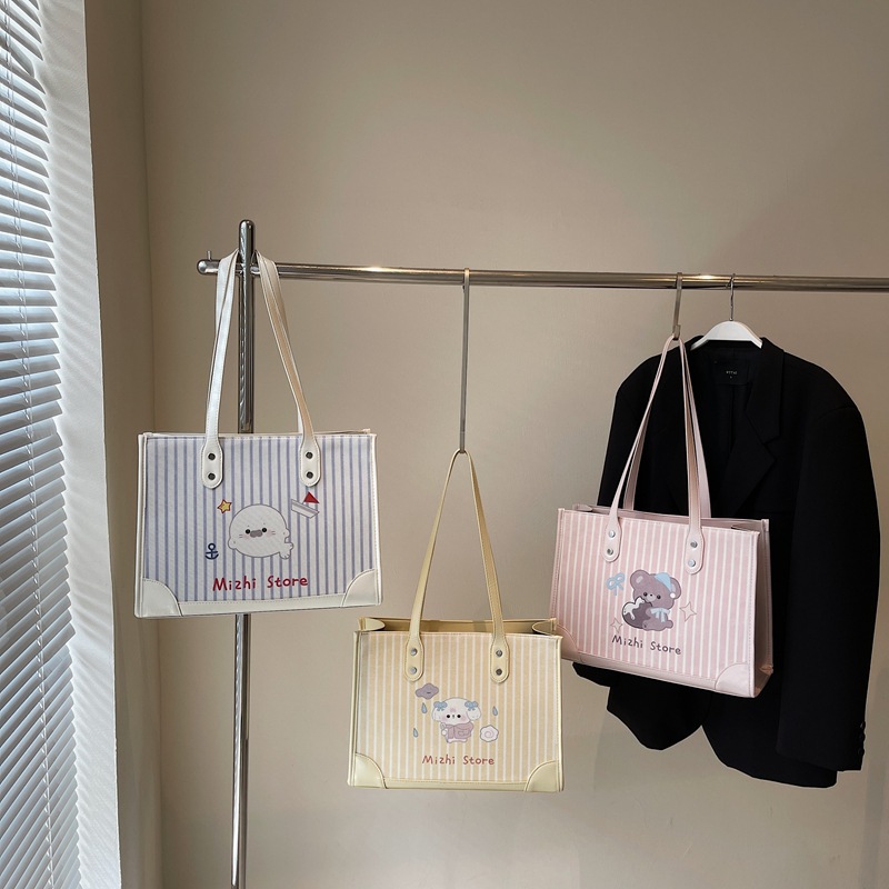 Fashionable and trendy cartoon pattern hand-held underarm bag for women 2025 new style fabric striped versatile large-capacity single-shoulder bag Application Scenario