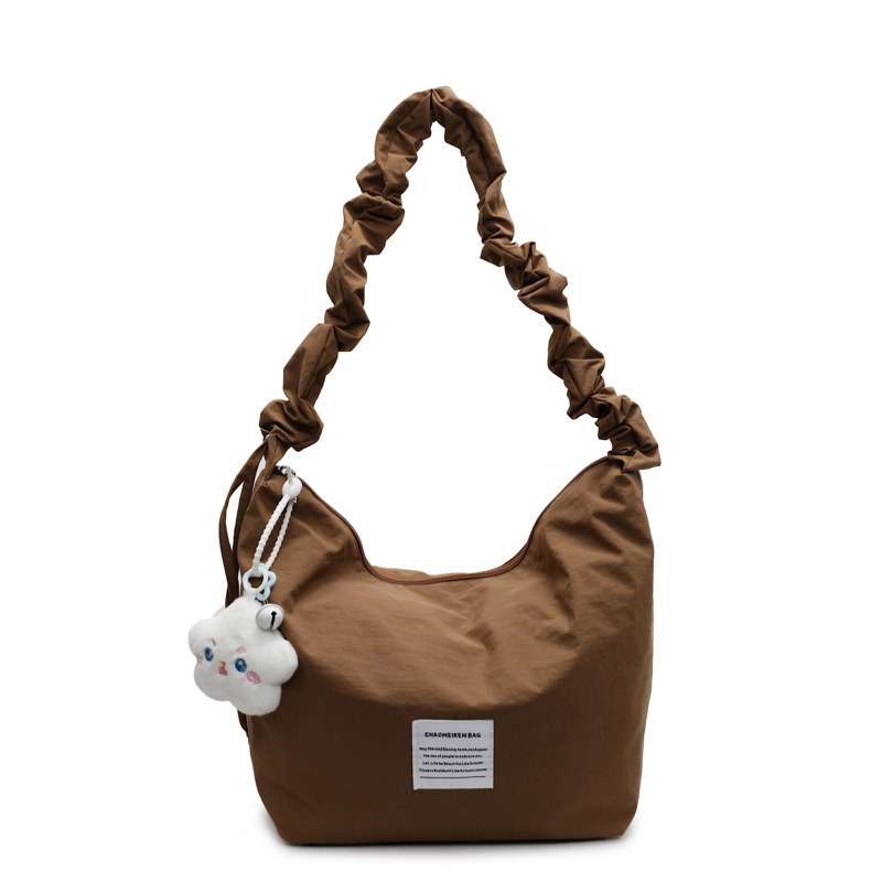 A new cream candy-colored single-shoulder canvas bag for spring and summer, with a large-capacity handbag, mommy bag and underarm bag Item Picture