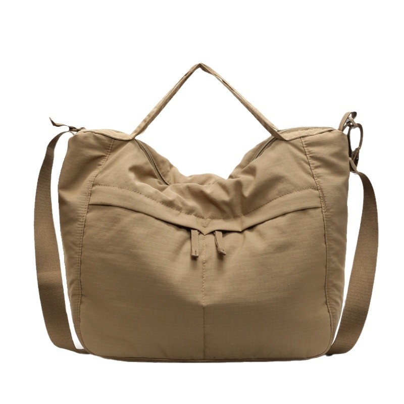 Waterproof nylon fabric dumpling bag for both men and women, simple and sporty style, large-capacity casual single-shoulder tote bag Item Picture
