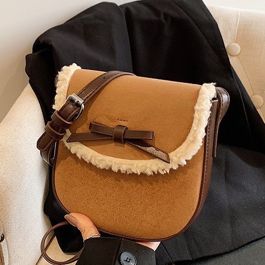 Color-blocking fashionable bow crossbody bag 2025 new matte texture plush backpack, a niche design handbag full figure