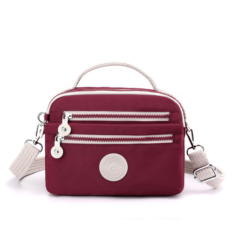 The 2025 new women's fashion trend single-shoulder bag, Japanese minimalist color-blocking crossbody bag, nylon mobile phone coin purse Item Picture