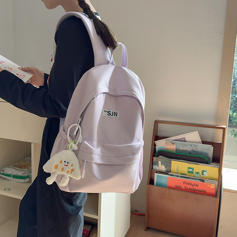 A simple and versatile solid-color backpack for female college students, a fresh and lightweight wide-shoulder backpack for junior and senior high school students details Picture