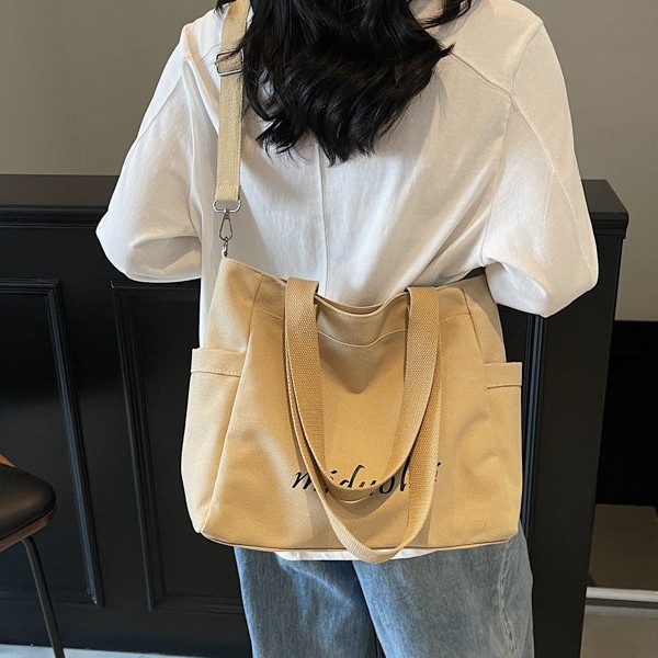 ins Korean style niche design canvas bag, women's high-end large bag, single-shoulder bag, large capacity, versatile commuter tote bag Application Scenario