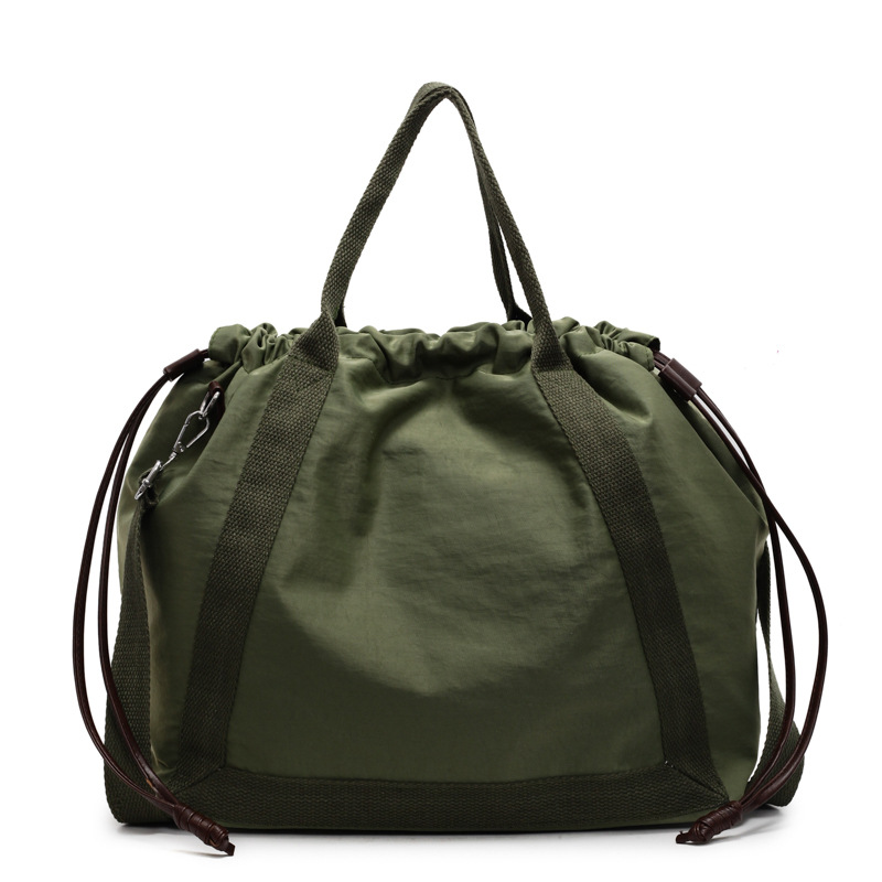 Large-capacity student commuting crossbody bag, simple and versatile female dopamine tote bag, drawstring design crossbody bag Item Picture