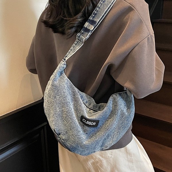 A new, fashionable and trendy single-shoulder crossbody bag with a solid color soft surface and large capacity, featuring a denim design details Picture