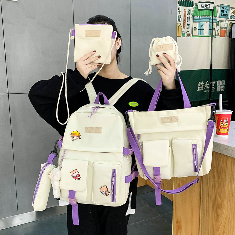 A new Korean-style canvas five-piece backpack for girls, a hand-held schoolbag for grade 34, 56 primary school students Application Scenario