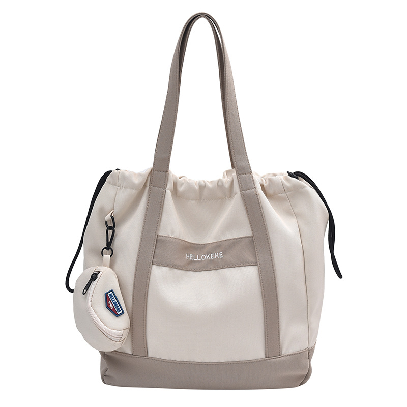The 2024 new large-capacity fabric commuting bag is a simple and versatile tote bag for students' classes Item Picture